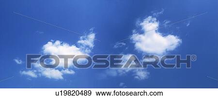 Blue sky and clouds View Large Photo Image Stock Photo - Blue sky and clouds. Fotosearch