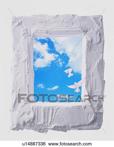 Stock Photograph - Blue sky and doves in a frame. Fotosearch