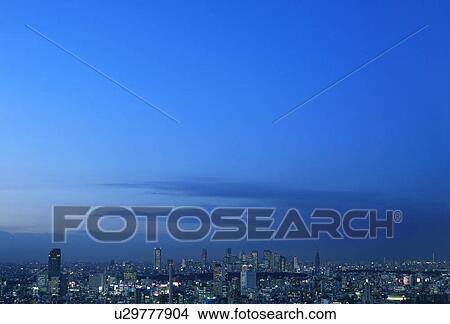 Picture - Blue sky over office buildings, copy space, Tokyo prefecture, Japan. Fotosearch