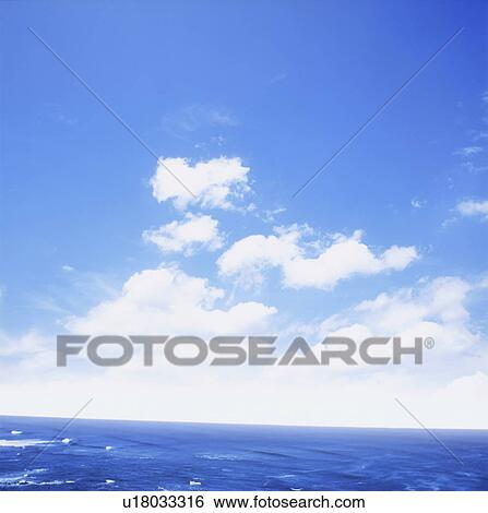 Stock Photograph - Blue sky over sea. Fotosearch