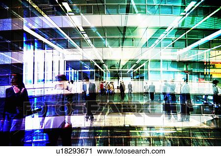 Stock Image - Blurred Image of People Walking Through a Station. Nagoya, Aichi Prefecture, Japan. Fotosearch