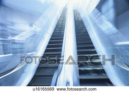 Stock Photo - Blurred View of an Escalator. Minato-ku, Tokyo, Shiodome, Japan. Fotosearch