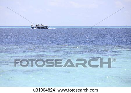 Boat off the shore, Maldive Islands View Large Photo Image Picture - Boat off the shore, Maldive Islands. Fotosearch