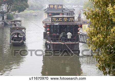 Stock Image - Boats on river, China. Fotosearch