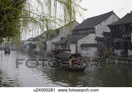 Stock Image - Boats on river, China. Fotosearch