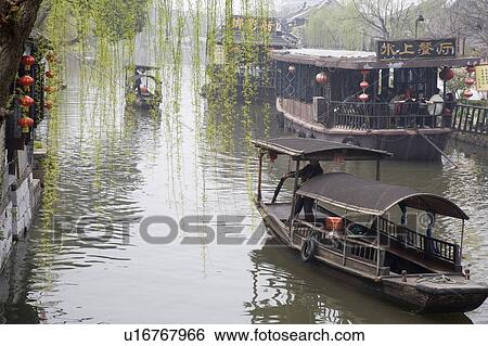 Stock Photograph - Boats on river, China. Fotosearch