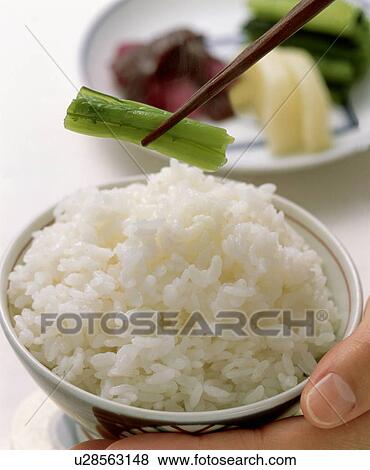 Stock Photo - Boiled rice with pickled vegetable. Fotosearch