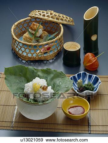 Stock Photo - Boiled saltwater eel and eel sushi with sake. Fotosearch
