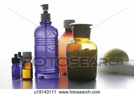Bottles of aromatherapy oil, white background View Large Photo Image Stock Image - Bottles of aromatherapy oil, white background. Fotosearch