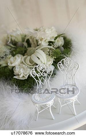 Bouquet of flowers and two miniature chairs View Large Photo Image Stock Photograph - Bouquet of flowers and two miniature chairs. Fotosearch