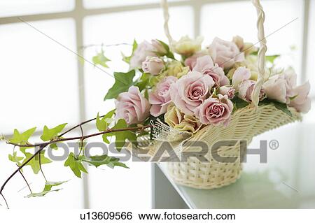 Stock Photograph - Bouquet of flowers in basket. Fotosearch