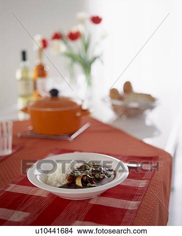 Picture - Bowl of casserole and potato mash on table. Fotosearch