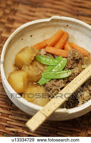 Bowl of potatoes and beef cooked in soy sauce View Large Photo Image Stock Photo - Bowl of potatoes and beef cooked in soy sauce. Fotosearch