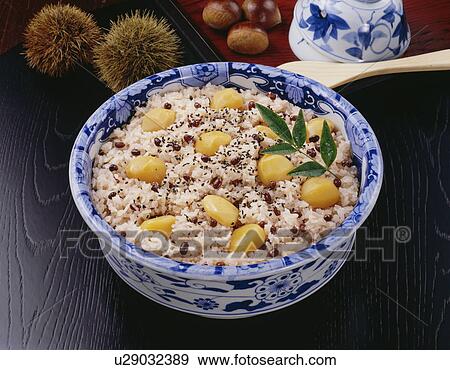 Stock Photo - Bowl of red rice cooked with chestnuts. Fotosearch