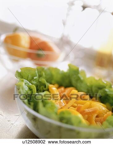 Stock Image - Bowl of salad on table. Fotosearch