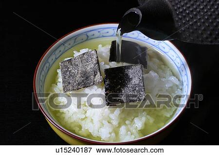 Bowl of steamed rice with green tea View Large Photo Image Stock Photo - Bowl of steamed rice with green tea. Fotosearch