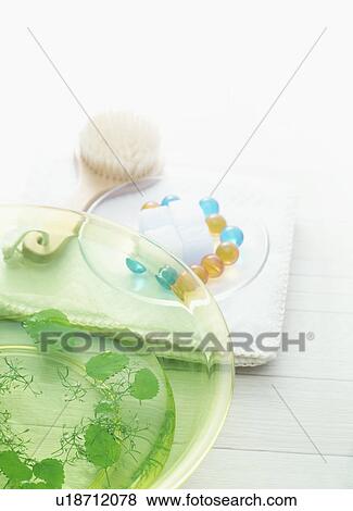 Bowl with herbs and toiletries on towel View Large Photo Image Stock Photo - Bowl with herbs and toiletries on towel. Fotosearch