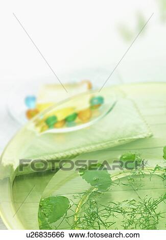 Bowl with herbs and toiletries on towel View Large Photo Image Stock Photograph - Bowl with herbs and toiletries on towel. Fotosearch
