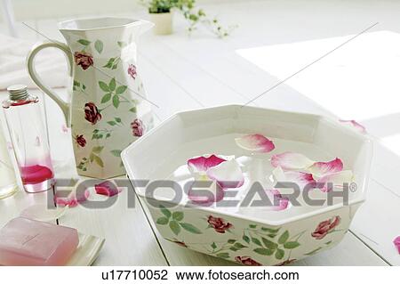 Bowl with water and flower petals View Large Photo Image Stock Image - Bowl with water and flower petals. Fotosearch