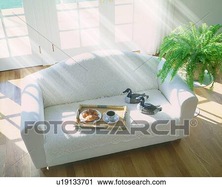 Bread and cup of coffee on sofa in living room, computer graphic View Large Photo Image Stock Image - Bread and cup of coffee on sofa in living room, computer graphic. Fotosearch