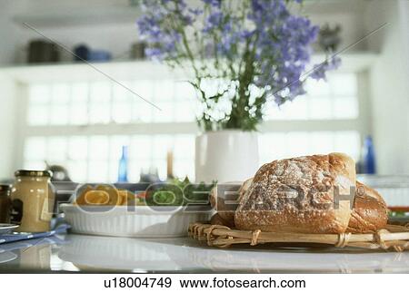 Stock Photo - Bread and salad with vase of flowers. Fotosearch
