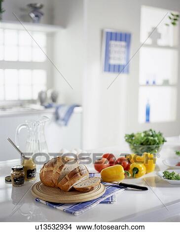 Bread and vegetables on kitchen counter View Large Photo Image Picture - Bread and vegetables on kitchen counter. Fotosearch