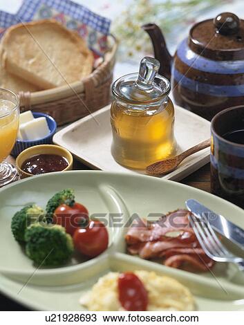 Stock Image - Breakfast with honey. Fotosearch