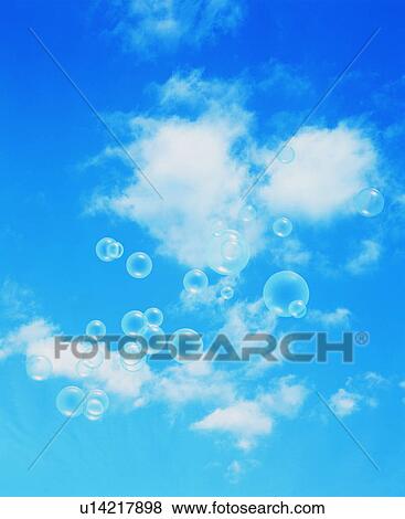 Bubbles floating through the air View Large Photo Image Stock Photo - Bubbles floating through the air. Fotosearch
