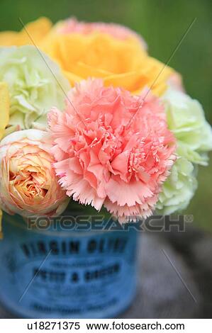 Stock Photography - Bunch of flowers, carnations, roses and ranunculus, close up. Fotosearch