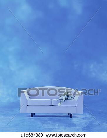Bunch of flowers on white sofa View Large Photo Image Stock Image - Bunch of flowers on white sofa. Fotosearch