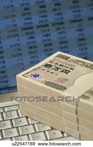 Bundles of 10 000 yen notes on a computer keyboard View Large Photo Image Stock Photo - Bundles of 10 000 yen notes on a computer keyboard. Fotosearch