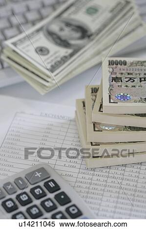Bundles of Japanese and US currencies View Large Photo Image Stock Photography - Bundles of Japanese and US currencies . Fotosearch
