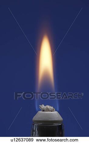 Stock Photo - Burner making fire, blue background. Fotosearch