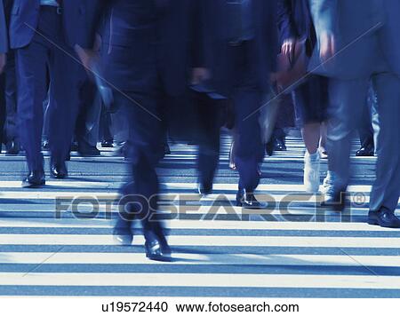 Businessmen crossing at a crosswalk View Large Photo Image Stock Image - Businessmen crossing at a crosswalk . Fotosearch