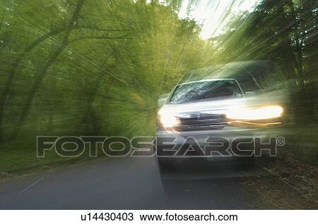 Car driving on forest road View Large Photo Image Stock Image - Car driving on forest road. Fotosearch