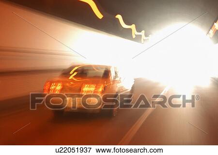 Car driving through tunnel View Large Photo Image Stock Photo - Car driving through tunnel. Fotosearch