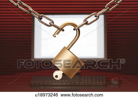 Stock Photograph - Chain and padlock with key, computer in background. Fotosearch