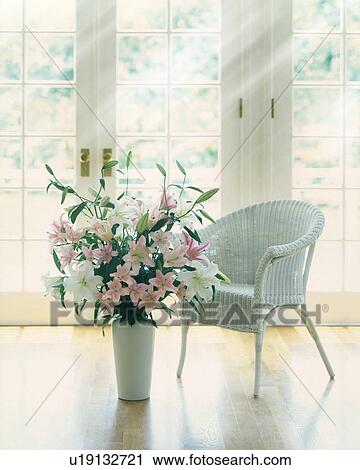 Stock Image - Chair and vase of flowers by window, computer graphic. Fotosearch