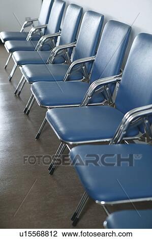Stock Image - Chairs placed in line. Fotosearch