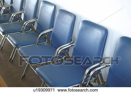 Stock Image - Chairs placed in line. Fotosearch
