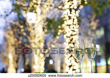 Stock Photography - Champagne and Christmas lights. Fotosearch