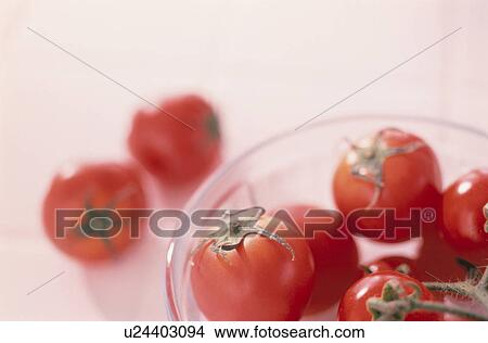 Picture - Cherry tomatoes in a glass bowl. Fotosearch