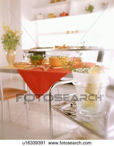 Stock Image - Chilled wine near dining table. Fotosearch