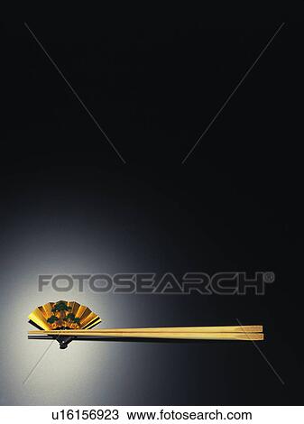 Stock Image - Chopstick and fan shaped chopstick rest. Fotosearch