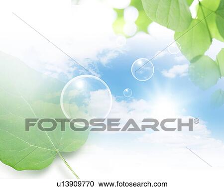 Stock Image - Clear circles and leaves against a blue sky. Fotosearch
