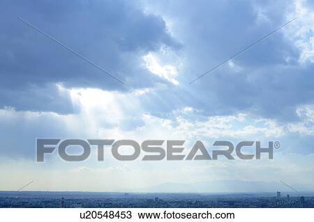 Clouds and sunbeams over city, Tokyo prefecture, Japan View Large Photo Image Stock Image - Clouds and sunbeams over city, Tokyo prefecture, Japan. Fotosearch