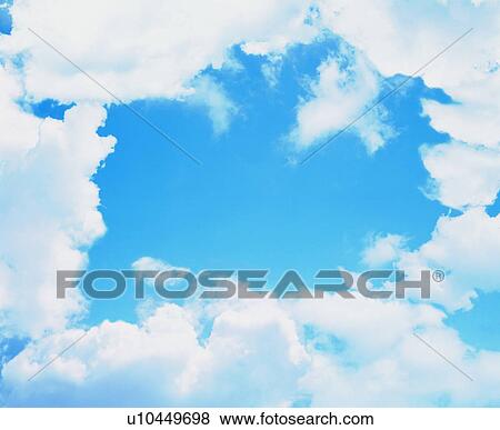 Stock Photo - Clouds framing blue sky. Fotosearch