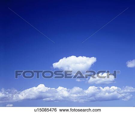 Stock Photograph - Clouds in blue sky, Biei town, Hokkaido prefecture, Japan. Fotosearch