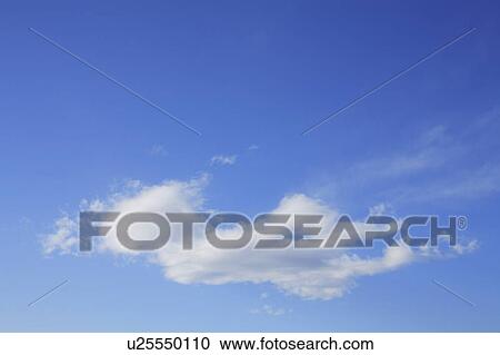 Stock Image - Clouds in blue sky, blue background. Fotosearch