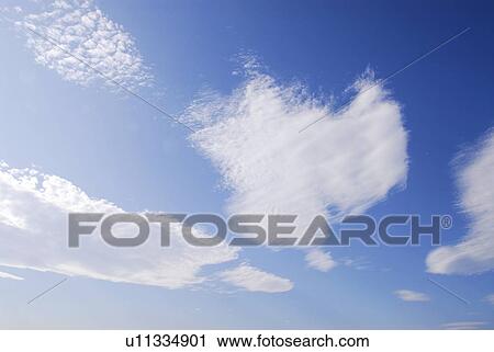 Stock Image - Clouds in blue sky. Fotosearch